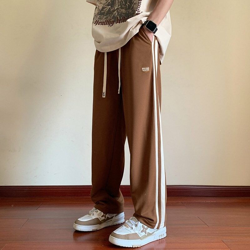 男性レジャー運動とベルベットの厚いコーデュロイ長ズボンのストレートゆるい長ズボン